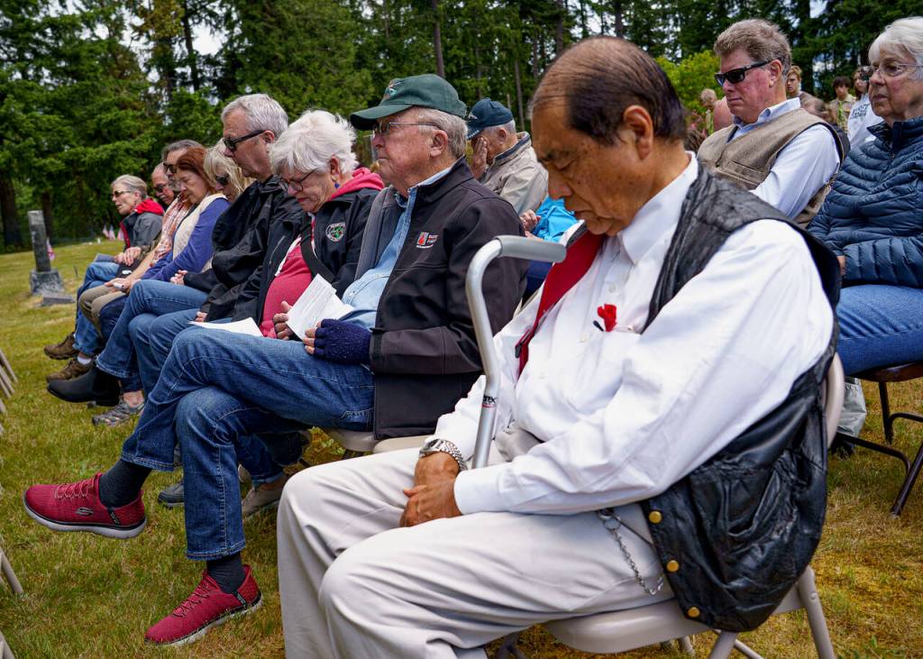 Photo by David Welton
An audience observes a moment of silence during the ceremony.