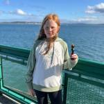 Photo by Stacy Penny
Clementine Penny shows off her second place trophy on the ferry ride home from Port Townsend.