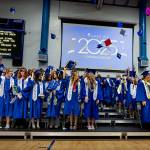 South Whidbey grads toss their caps in the air after graduating.