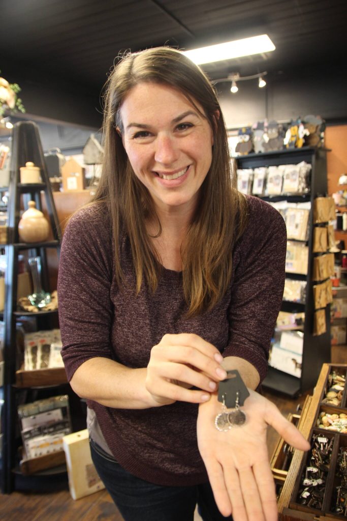 Jobeth Glenday proudly displays her handmade earrings.