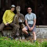 Photo by David Welton
Mike Gerhardt and Sean Wilson pose with a wooden sculpture, created by Pat McVay in the 1980s, that was found on their property.