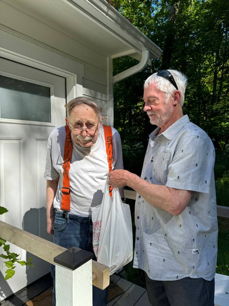 Photo courtesy of Island Senior Resources
Ralph Lueken, a Meals on Wheels recipient with volunteer Ron Ward.