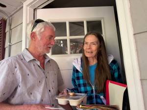 Volunteer Ron Ward with Theresa Williams, a Meals on Wheels recipient (photo courtesy of Island Senior Resources).