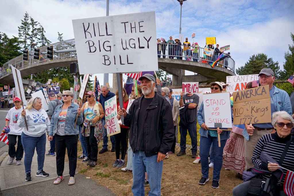 This sign references President Donald Trumps $4 trillion tax and spending bill, as said by Tesla CEO Elon Musk.