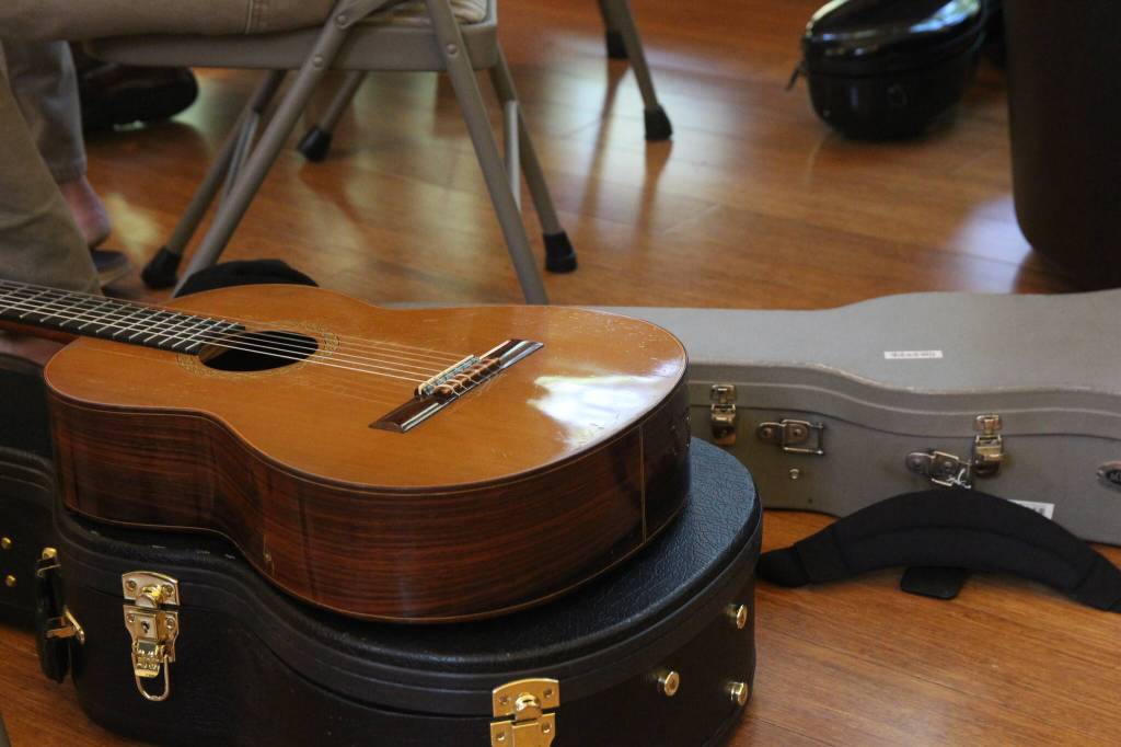 A guitar sits on its case (Photo by Allyson Ballard)
