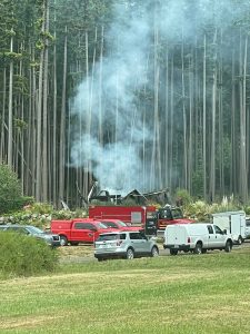 The remains of a house were still smoking the day after an explosion and fire destroyed the structure and killed a man.