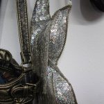 A bedazzled bra hangs next to a vintage purse (Photo by Marina Blatt)