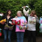 I Support The Girls Whidbey Island volunteers laugh together as they showcase some decorated bras that will be at the auction. From left, Julie Rhodes, Kris Bobadilla, Candy Pearson, Wendy Rue and Kate Mistler (Photo by Marina Blatt)