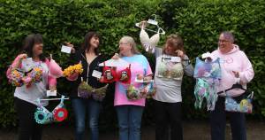 Photo by Marina Blatt
I Support The Girls Whidbey Island volunteers laugh together as they showcase some decorated bras that will be at the auction. From left, Julie Rhodes, Kris Bobadilla, Candy Pearson, Wendy Rue and Kate Mistler