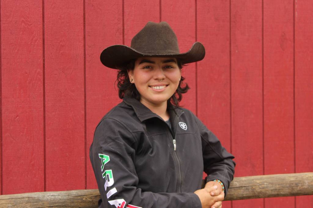 Rhed Locke poses in front of her barn (Photo by Allyson Ballard)