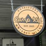 Camp Kids outdoorsy sign, hanging above the stores entry (Photo by Allyson Ballard)
