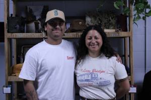 Levi and Shannon Woods pose inside their new business venture (Photo by Allyson Ballard)