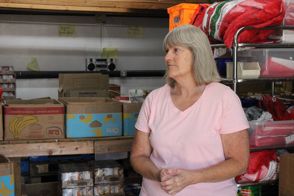Jean Wieman stands in the Help Houses warehouse (Photo by Allyson Ballard)