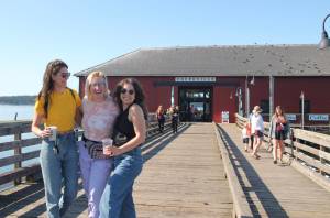 Photo by Marina Blatt
From left, Chelsea Reid, Tegan and Ellie Stewart spend a sunny day at the wharf