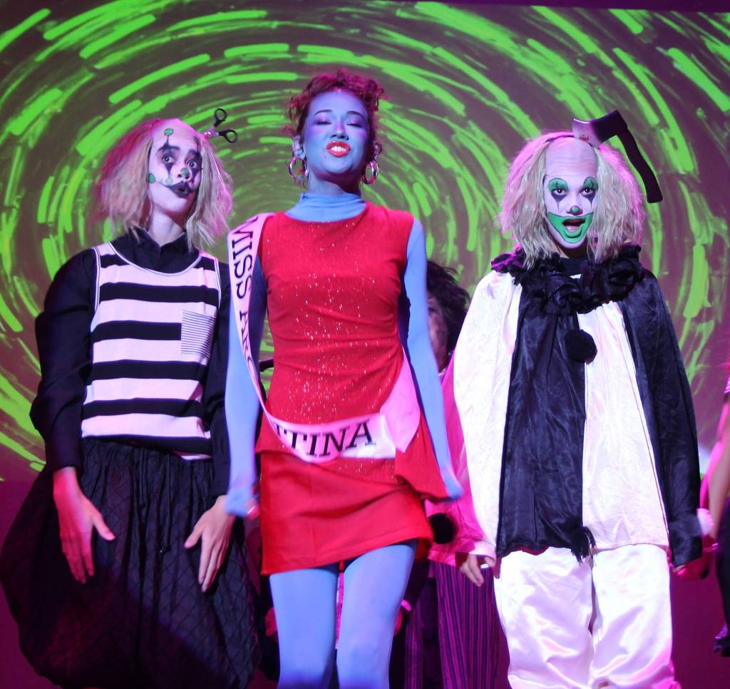 (Photo by Marina Blatt) Beetlejuice Clones One and Two, Jack Johnson and Kepanoinoapa Nero dance with Miss Argentina, Adriana Froman, in the Netherworld.