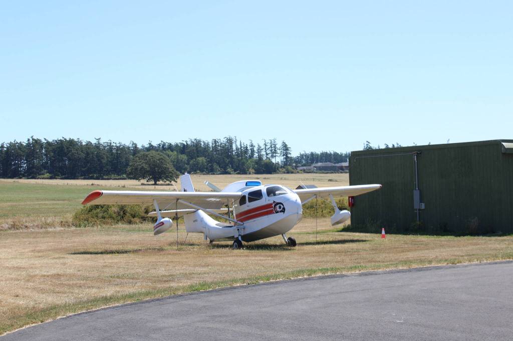 A plane and the airports vast property behind it (Photo by Allyson Ballard).