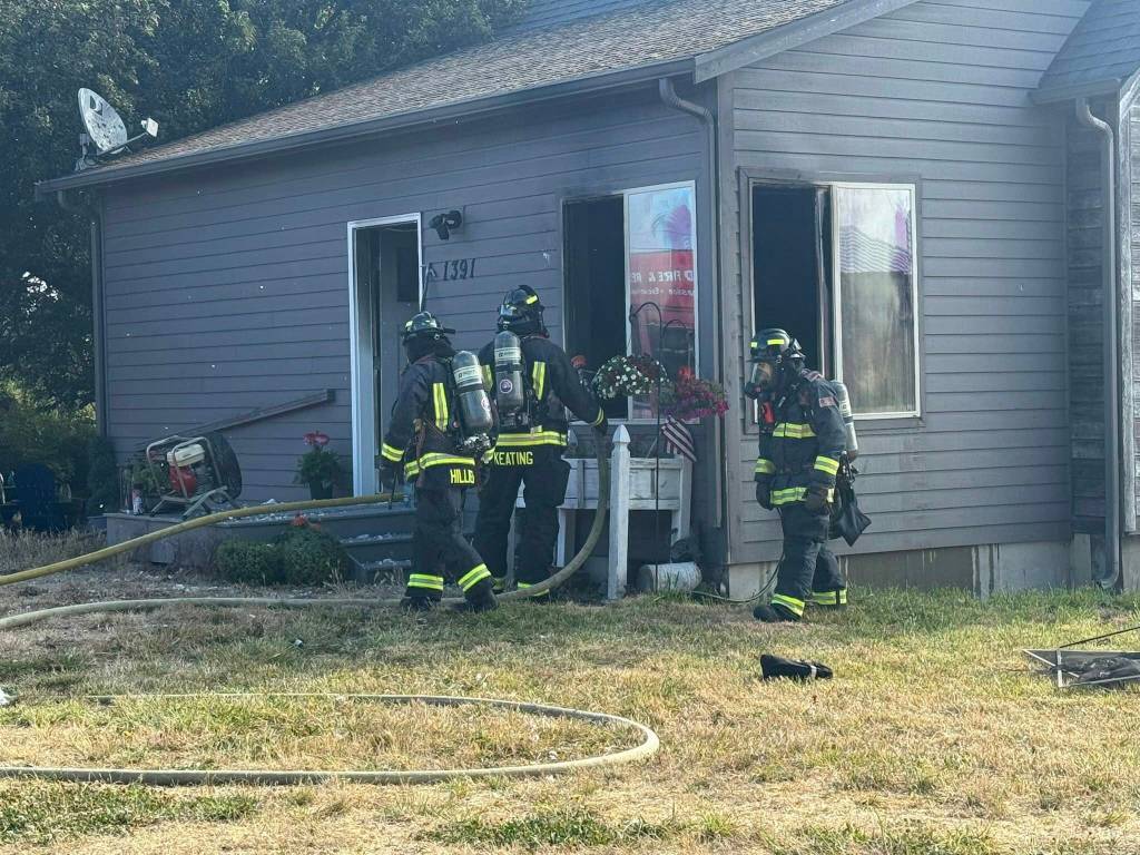 (Photo by Central Whidbey Island Fire and Rescue). Firefighters respond to a residential fire.