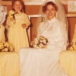 (Photo provided) Benson poses as a flower girl next to her mom in her wedding dress.