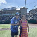 Photo provided 
Singer Mira Arcilla stands next to Everett AquaSox On-Field Emcee Steve Willits.