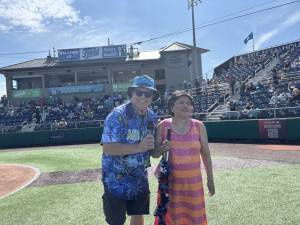 Photo provided 
Singer Mira Arcilla stands next to Everett AquaSox On-Field Emcee Steve Willits.