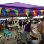 (Photo provided) Booths are decorated with colorful flags.
