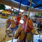 (Photo by David Welton) Aria Mami, 5, and her aunt Natalie Mami, both from Oak Harbor, enjoyed some good old-fashioned fun on the carousel.