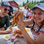 Fairgoers enjoy plenty of curly fries.