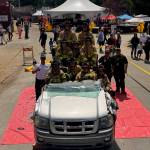 (Photo provided) South Whidbey firefighters demonstrate the different ways they can manipulate the vehicle to get patients out safely at the Whidbey Island Fair.