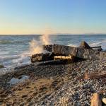 (Photo by Marina Blatt) A wave hits a rock at Point Partridge Tuesday evening, after a tsunami advisory on Whidbey.