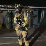 (Photo by South Whidbey Fire/EMS) Firefighter Carson Wrightson rescued a cat from a house fire in Clinton early Tuesday morning.