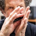 (File photo by Olivia Vanni) Lee Oskar plays on one of his custom harmonicas in his recording studio in his home in Everett.