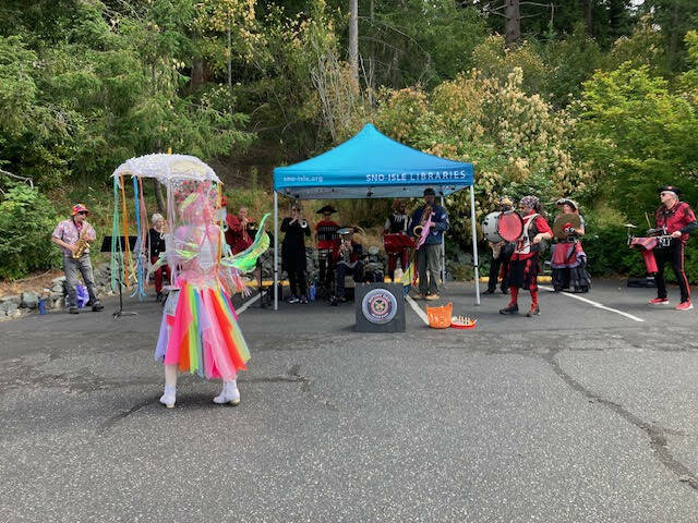 (Photo provided) The Mutiny Bay Brass Band plays for the Freeland Library Summer Festival.