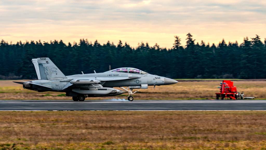 (Photo by Joe A. Kunzler | Simple Flying) Tires smoke on a Growler as it makes a touch-and-go landing at the Navy’s Outlying Field Coupeville.