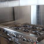 (Photo by Allyson Ballard) A six-burner stove is just one part of the new kitchen, making feeding the homeless far more efficient.