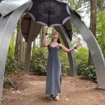 (Photo provided) A dancer holds an umbrella that appears to mimic the sculpture behind her.
