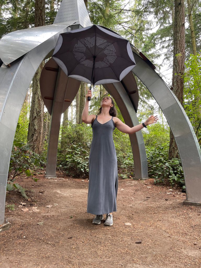 (Photo provided) A dancer holds an umbrella that appears to mimic the sculpture behind her.