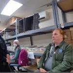 A still image from a police body camera shows Timothy Hazelo with an officer in the ballot counting room.