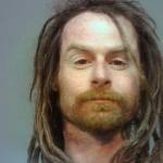 A mugshot from another state shows Waldbillig.