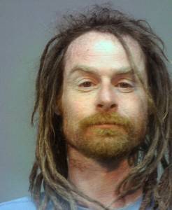 A mugshot from another state shows Waldbillig.