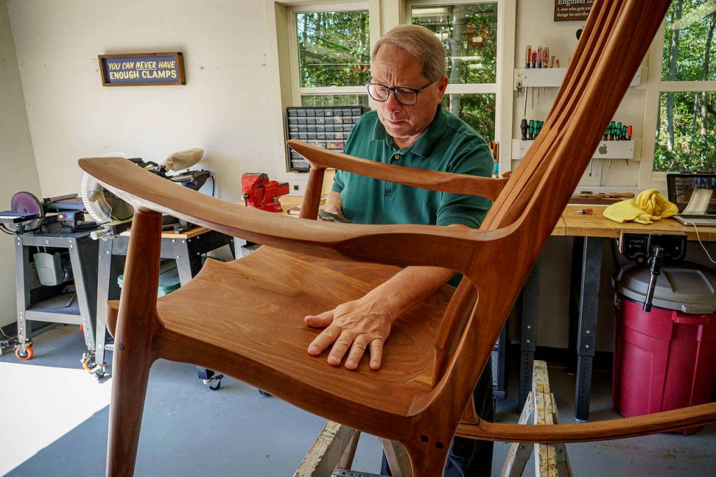 (Photo by David Welton) Scott Schmidt is bringing a cherry rocking chair with a walnut inlay to Woodpalooza.