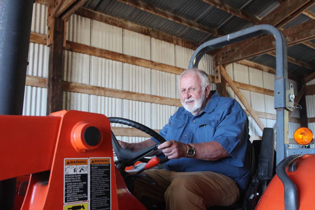 (Photo by Marina Blatt) Hank Hilberdink sits in his new tractor.