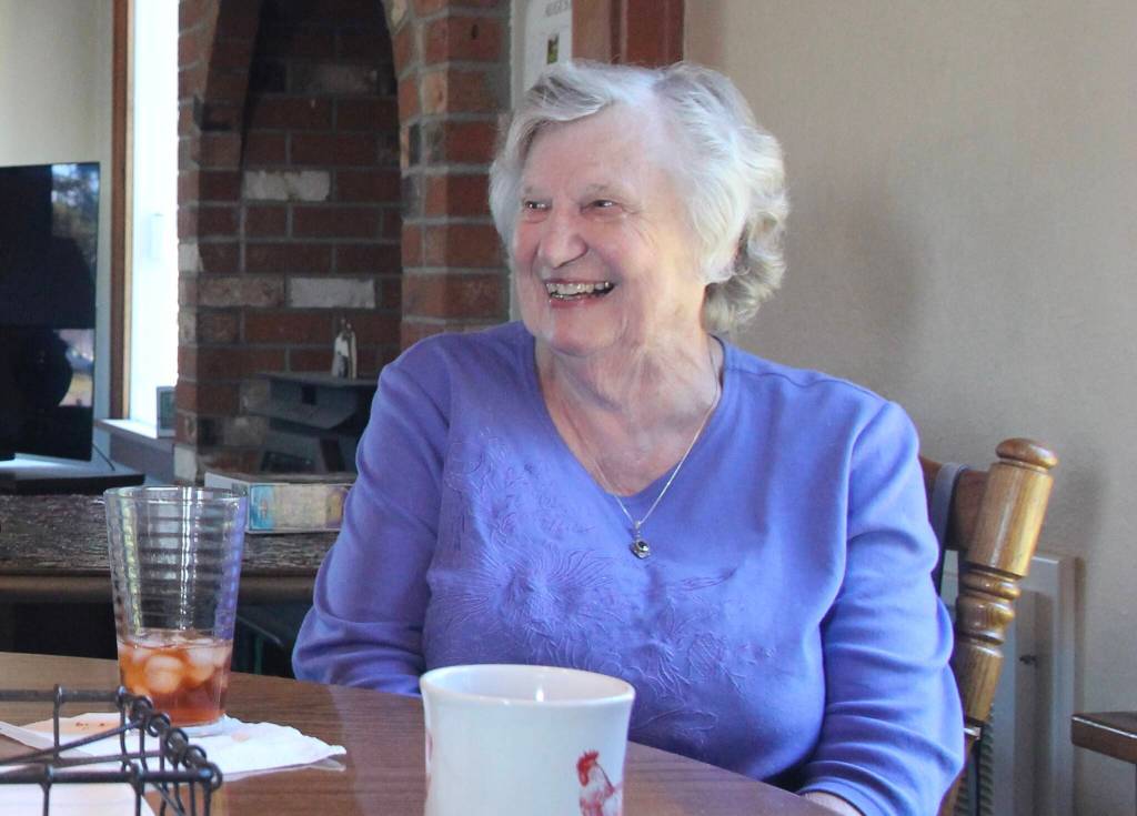(Photo by Marina Blatt) Betty Dyke laughs inside her family home.