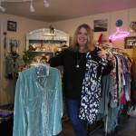 (Photo by Marina Blatt) Vicki Yount shows off the colorful clothing she sells in V-Boutique.