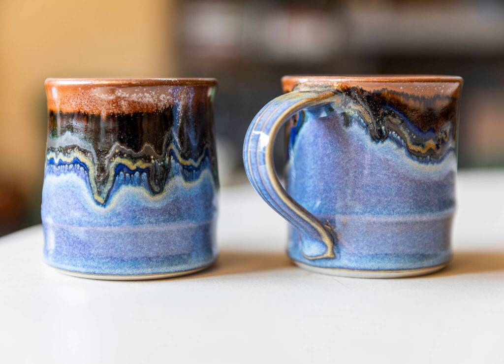 Two glazed mugs by StillFire Pottery in Freeland. (Olivia Vanni / The Herald)