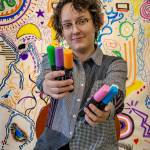 Photo by David Welton
Visitors are invited to contribute to the community mural, a tall, colorful wall of illustrations.