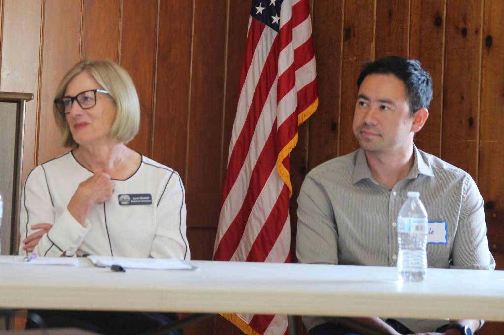 Oak Harbor board President Lynn Goebel state Rep. Clyde Shavers are all ears at the League of Woman Voter panel about school finances. (Photo by Marina Blatt.)