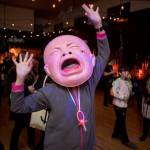 (Photo by David Welton) Creative costumes, such as this giant baby, are a staple of the Black Cat Ball.