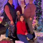 Photo provided
Queen-Bee Pantry board members take a photo with Santa at last year's Christmas Toy Drive.