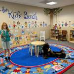 Photo provided
Alice Erwin smiles in the kids' reading area at a courthouse, which she helped to stock.