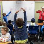 Anders Sherrett helps explain the steps fellow students need to follow for class at South Whidbey Elementary School on Sept. 22, 2025 in Langley, Washington. (Olivia Vanni / The Herald)